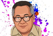 Oligarki Global di Balik Tragedi Perang Iran Amerika Israel 2026 Ilustrasi kartun potret wajah Ariady Achmad, seorang pria paruh baya mengenakan kacamata berbingkai cokelat dan kemeja safari cokelat muda, tersenyum ke arah kamera dengan latar belakang bercak cat estetik warna magenta, ungu, dan biru.